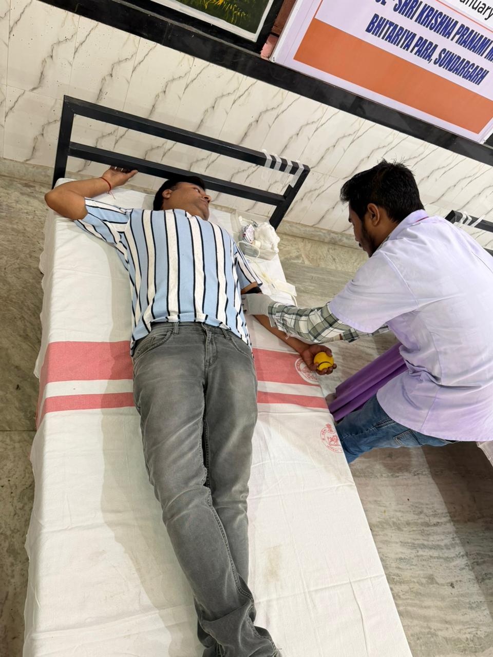 Male donor giving blood